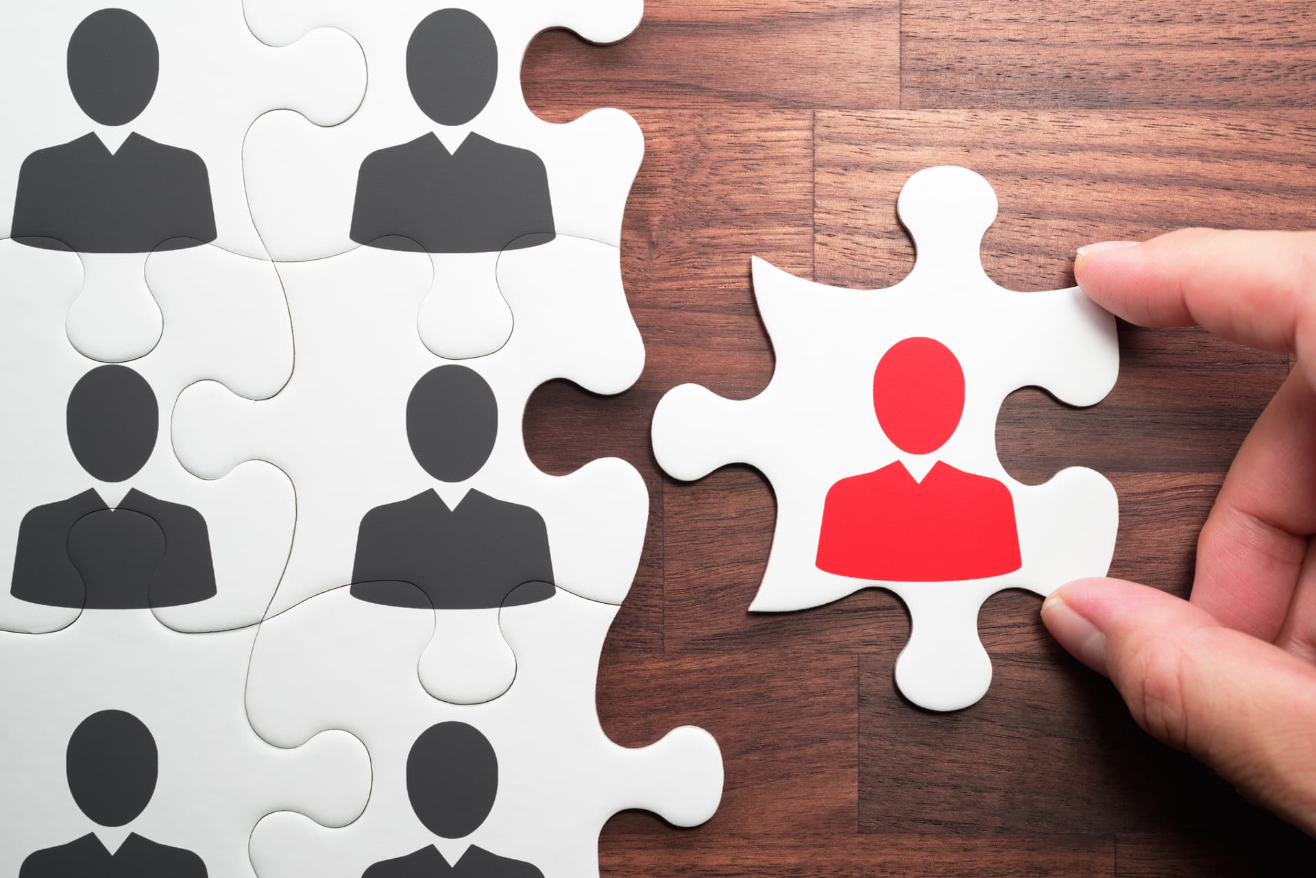 Image of a puzzle piece fitting into place, representing the hiring of personnel.