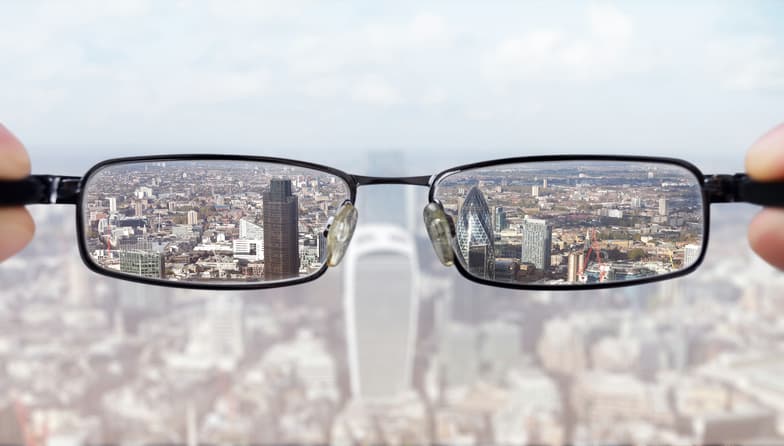 Looking through glasses to reveal detail as a metaphor for the importance of tranparency
