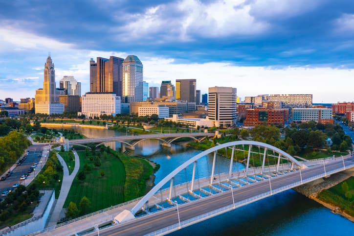 Aerial view of Downtown Columbus, Ohio, with the Scioto River during sunset.