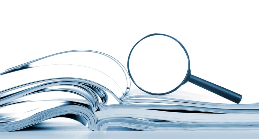 papers and magnifying glass