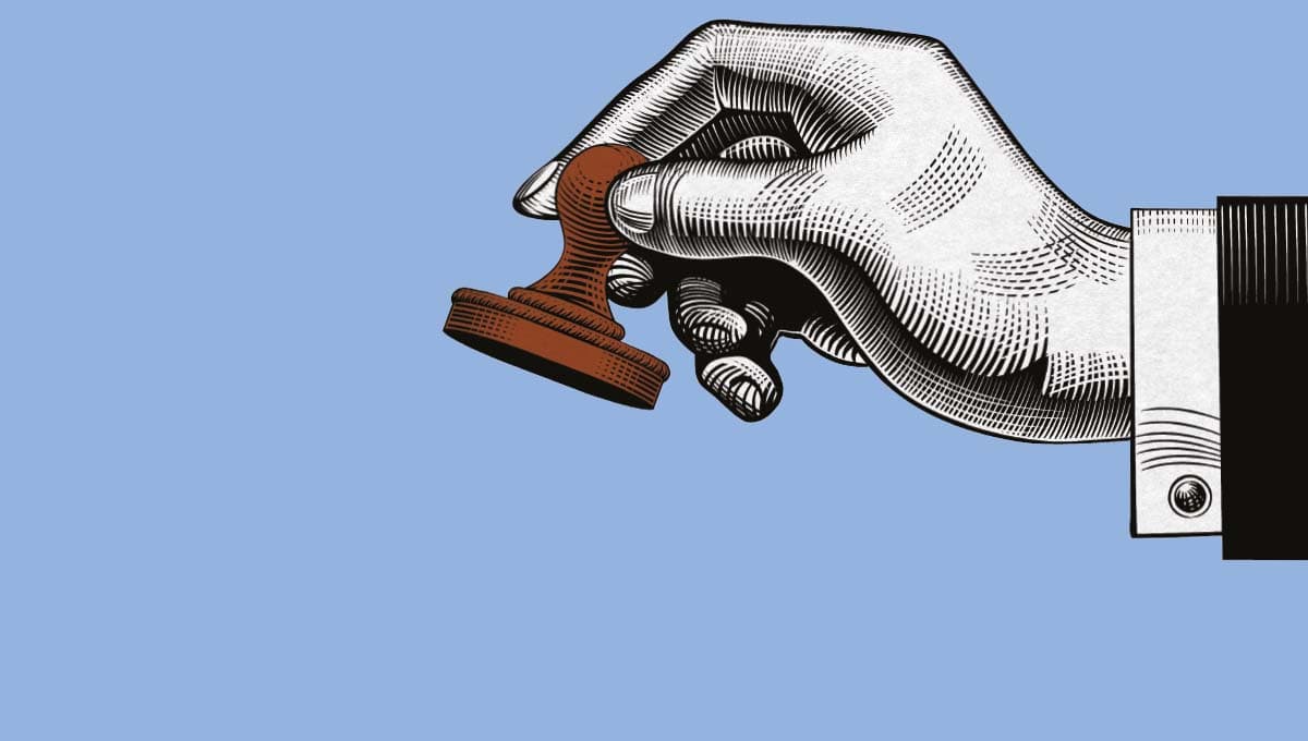 image of rubber stamp and hand