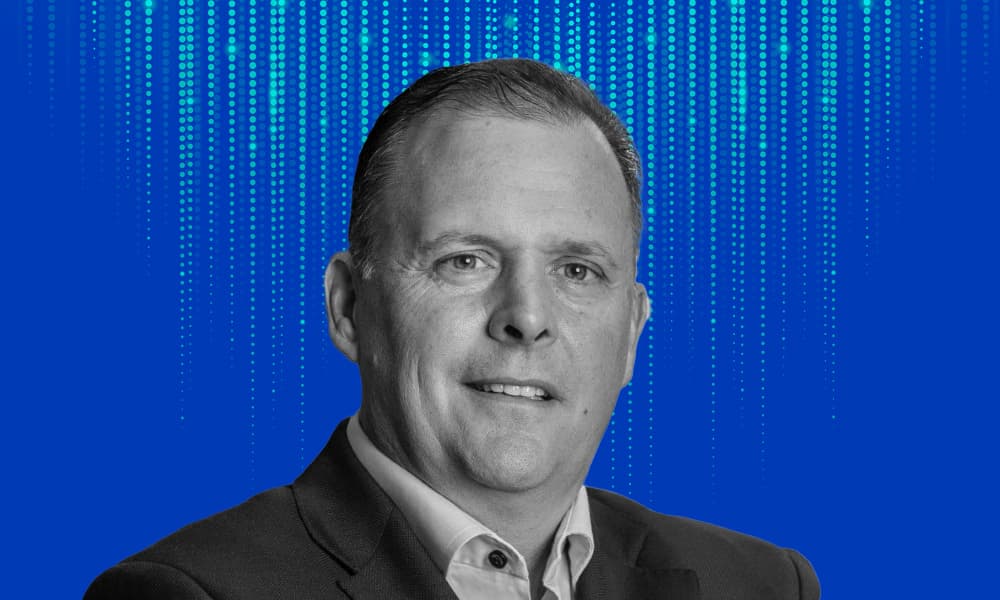 Headshot of BCI's Jim Pittman against a blue background