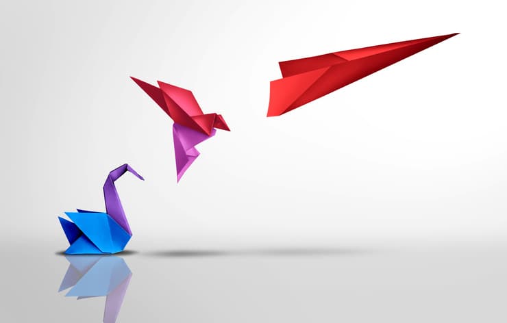 paper crane evolving into paper aeroplane