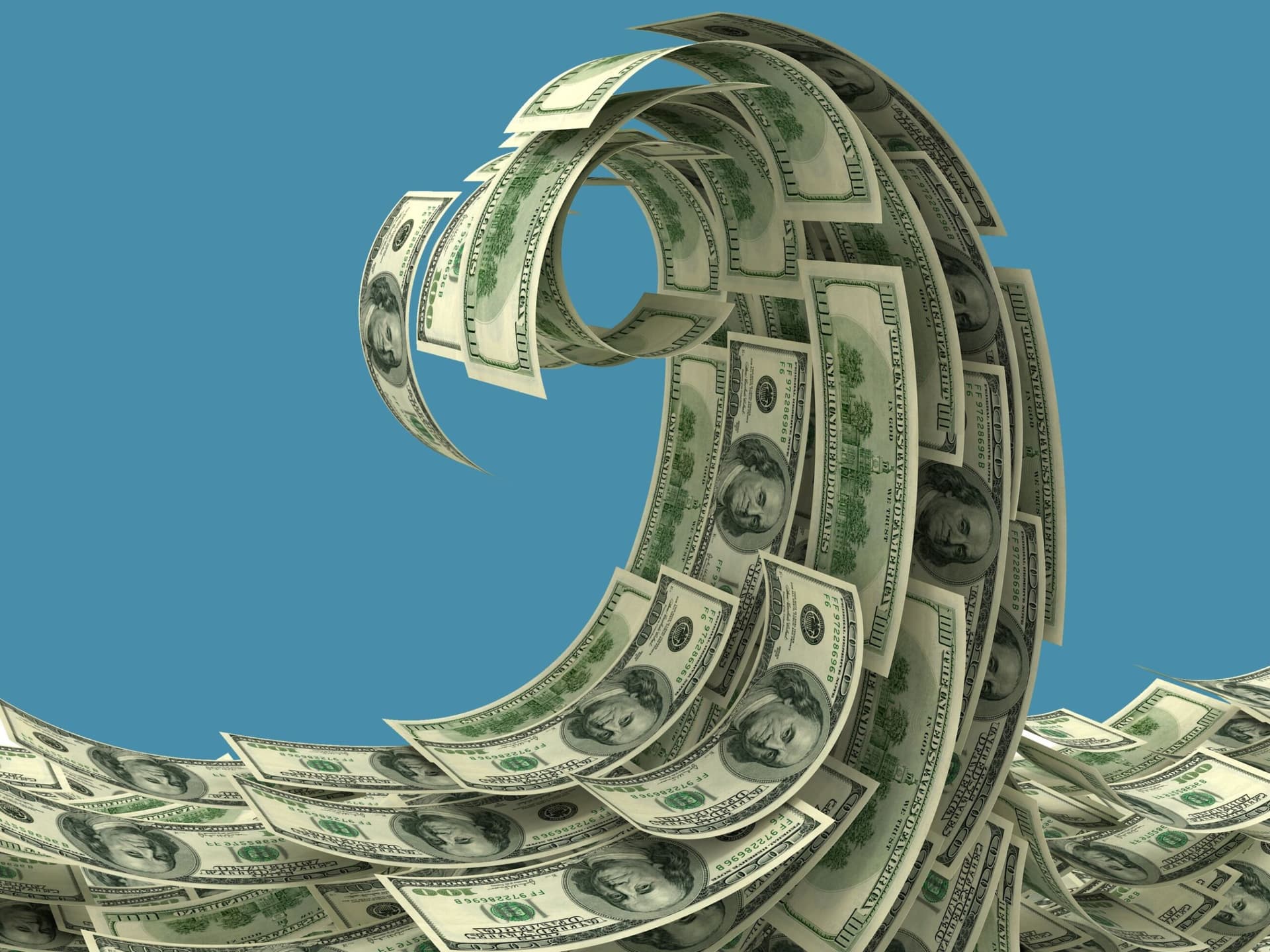 An ocean wave made up of dollar bills