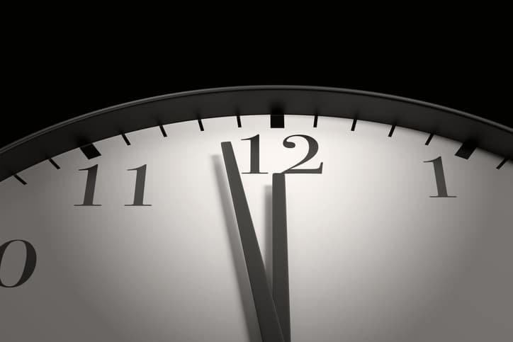 clock with hands nearing 12