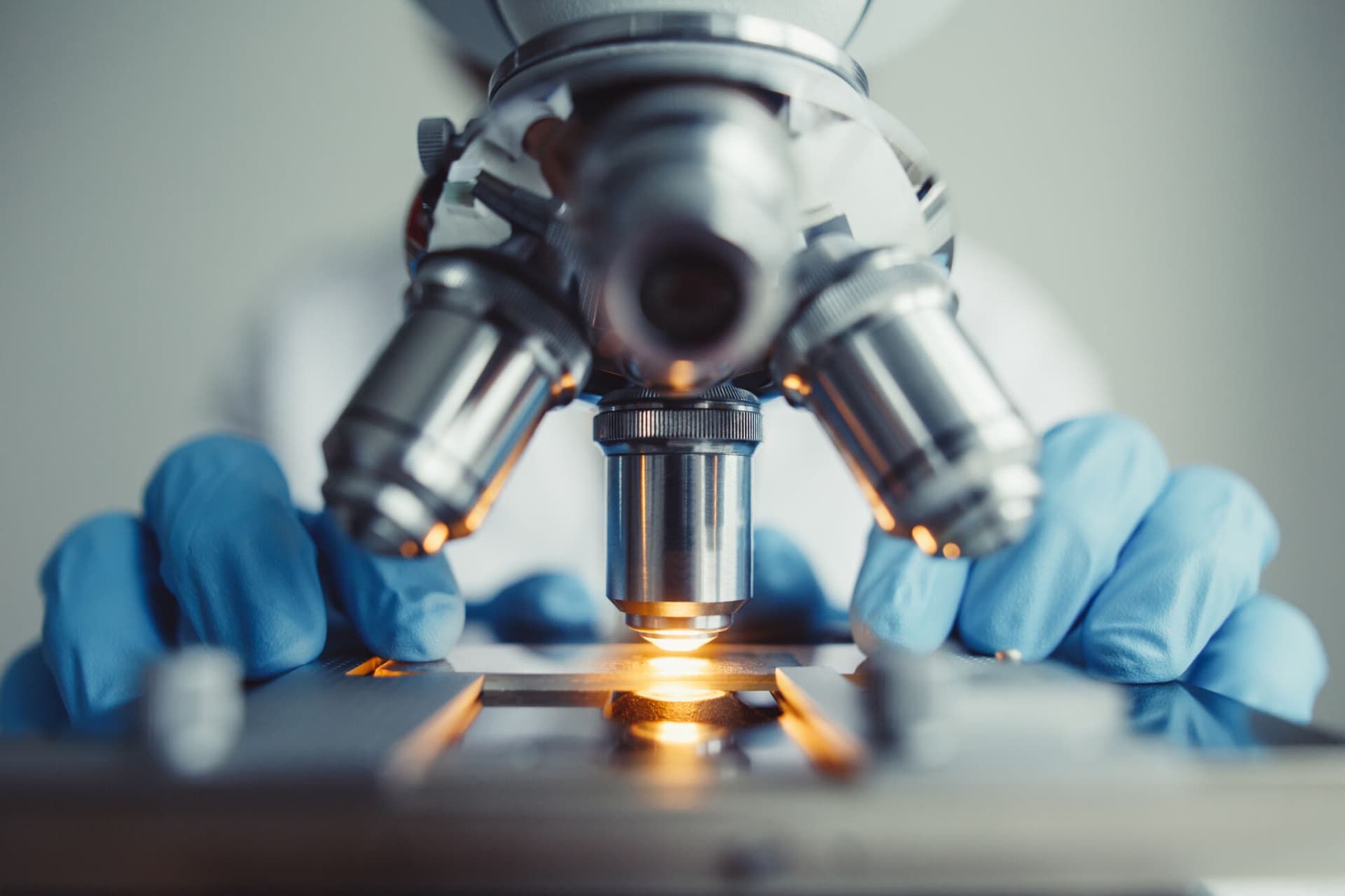A scientist using a microscope