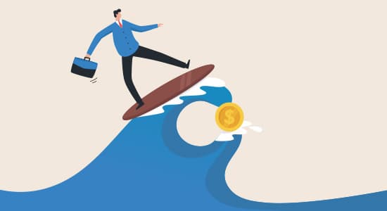 Man surfing a wave of money