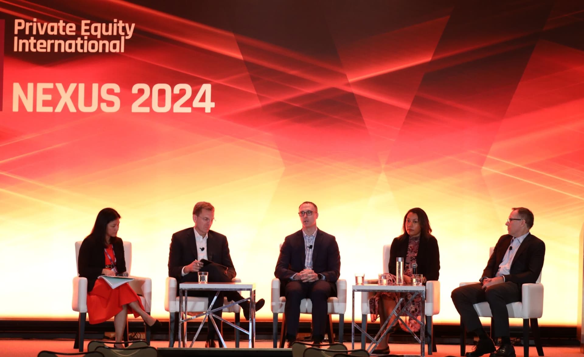 Panellists on stage at PEI Group's NEXUS 2024 summit
