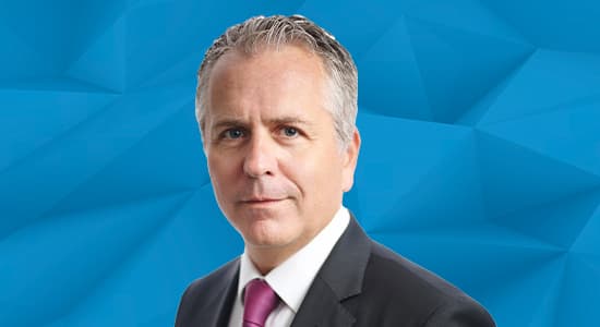 Headshot of Benoit Verbrugghe against a blue background