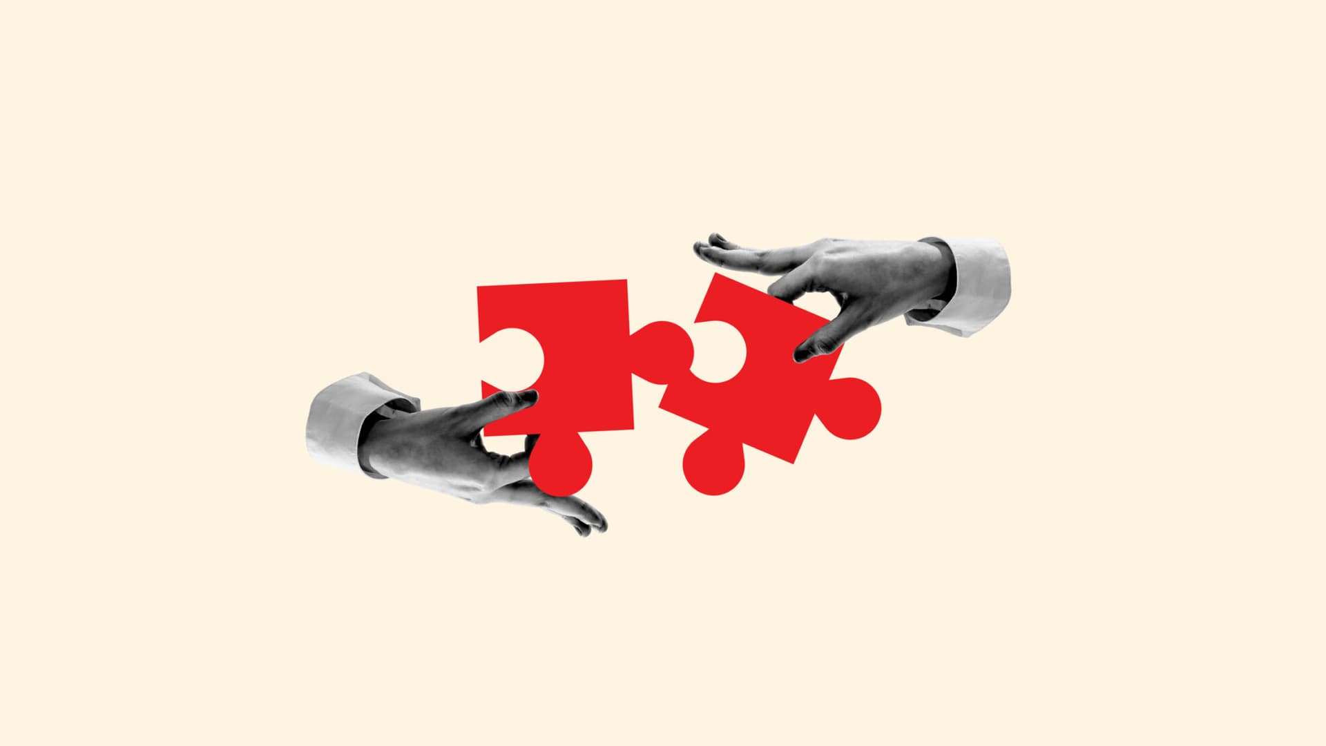 Two hands connecting or detaching two puzzle pieces
