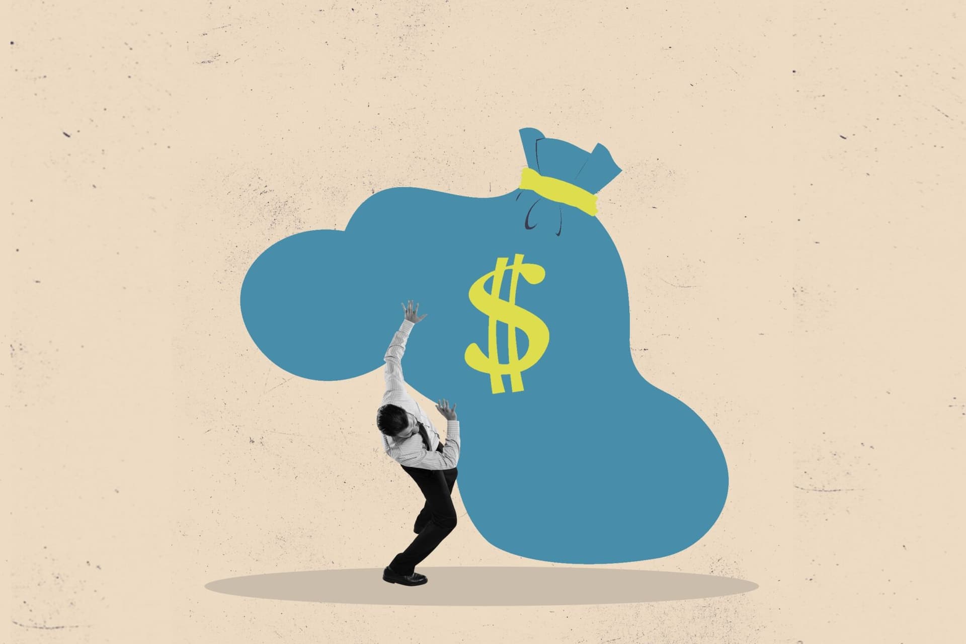 Businessman burdened by a blue sack of money