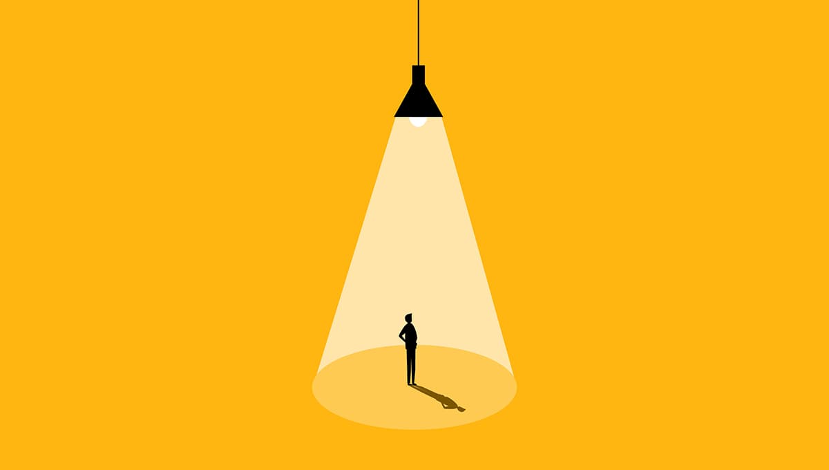 Illustration of a person standing under a spotlight being illuminated.