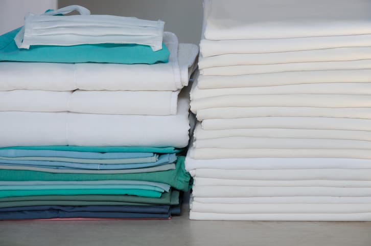 piles of medical hospital laundry and sheets