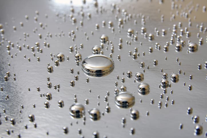 beads of mercury on silver platform