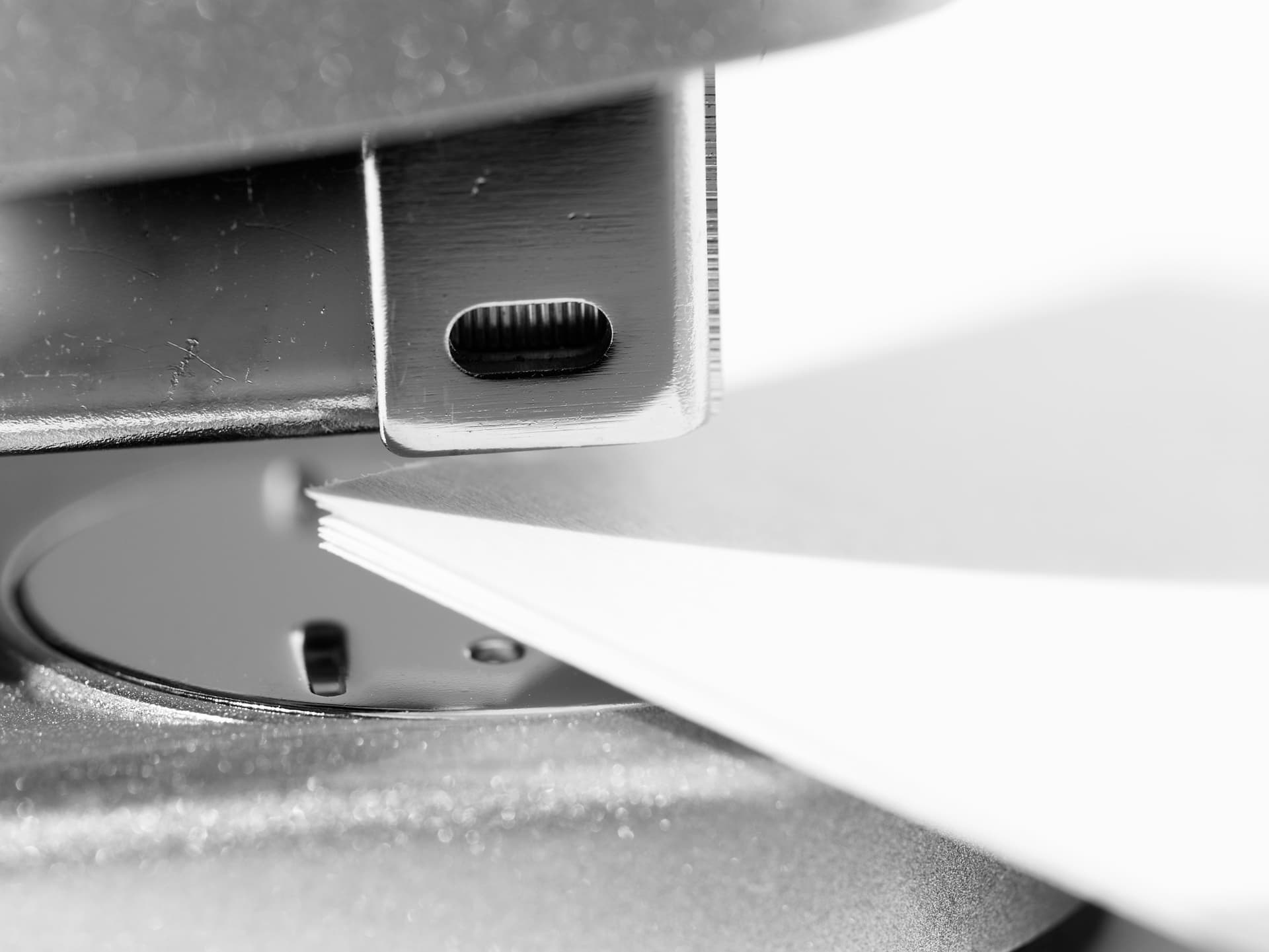 Close up of a stapler against a piece of paper