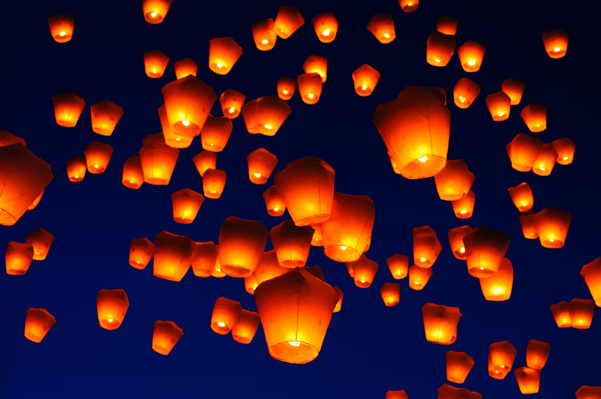Sky lanterns against the sky with blue tone
