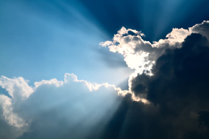Sunbeam through the black stormy cloud, silver lining
